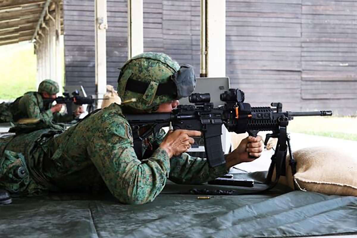 A Singapore Army soldier with the Colt IAR6940E-SG