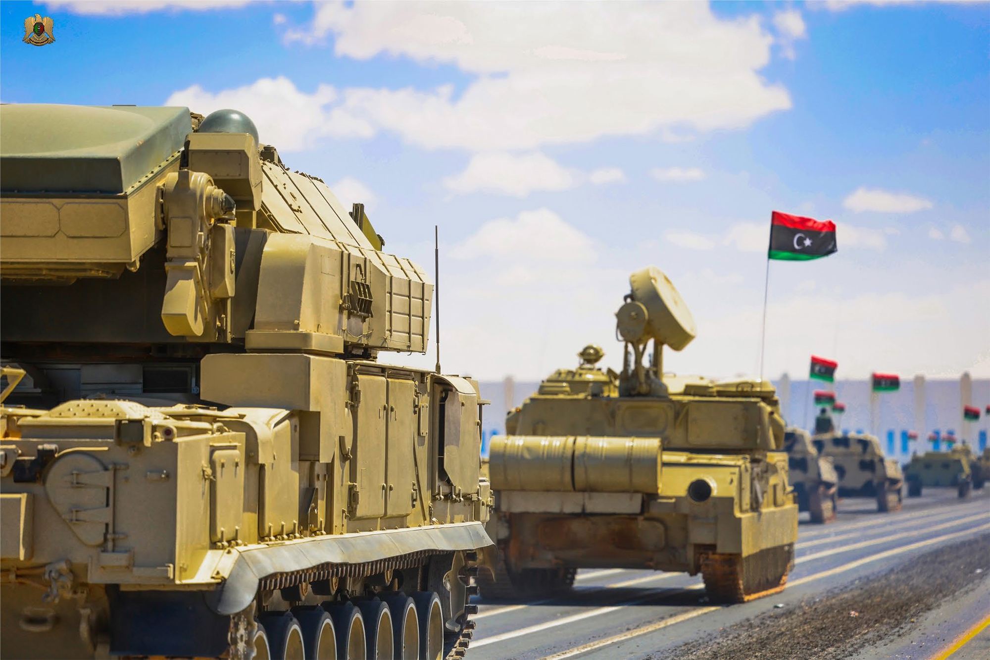 A Tor short-range air defence follows a ZSU-23-4 in the parade held at the new Military City south of Benghazi on 26 May 2025