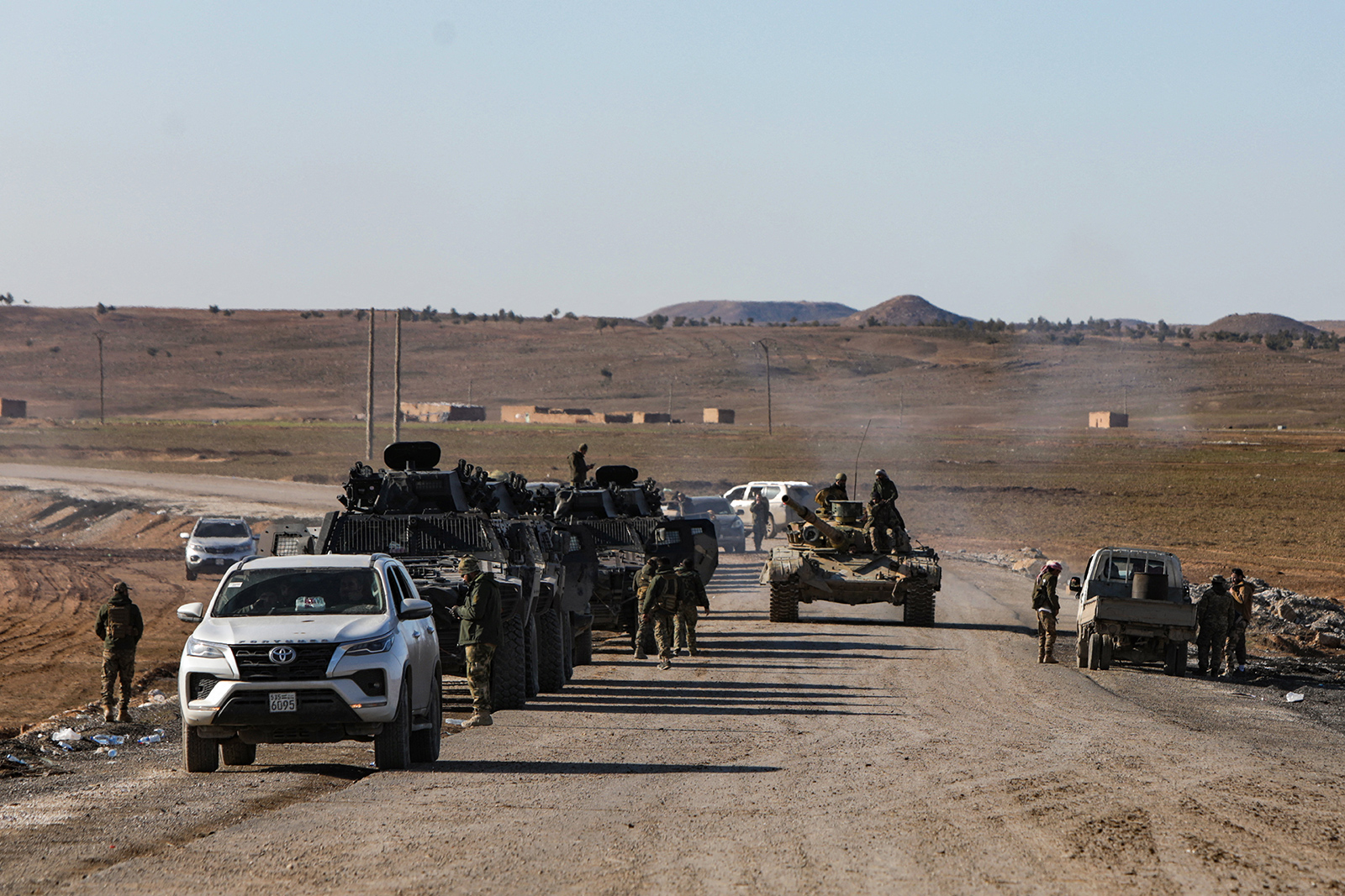 Armoured vehicles of the HTS de facto government make their way to the city of Hasaka in northeast Syria on 20 January 2026