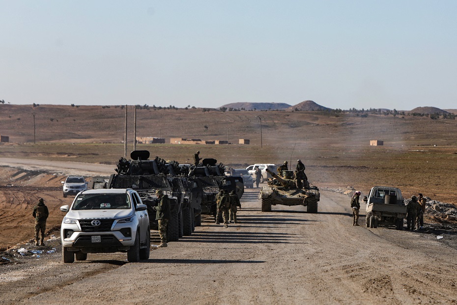 Armoured vehicles of the HTS de facto government make their way to the city of Hasaka in northeast Syria on 20 January 2026