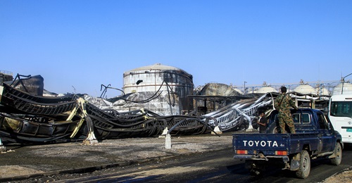 Photograph of a Sudanese army soldier standing on a truck at the heavily damaged Jaili Oil Refinery Sudans largest north of the capital Khartoum on 18 March 2025