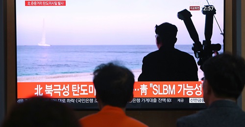 Photograph of TV footage showing launch of North Korean submarine launched missile