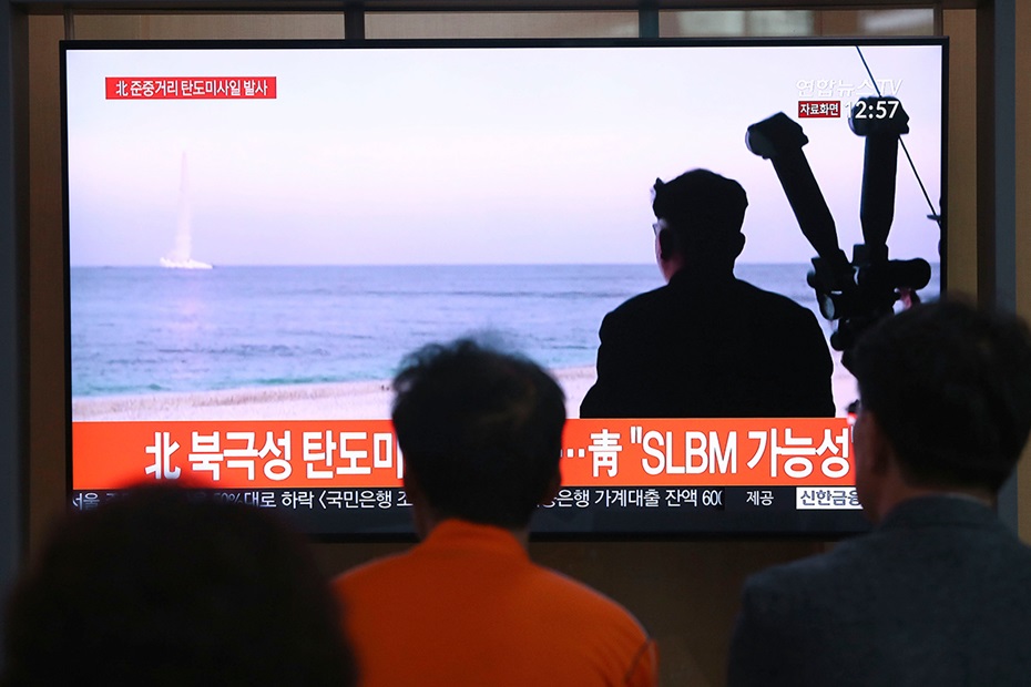 Photograph of TV footage showing launch of North Korean submarine launched missile