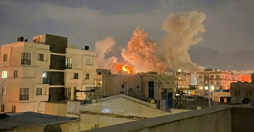 Plumes of smoke rise