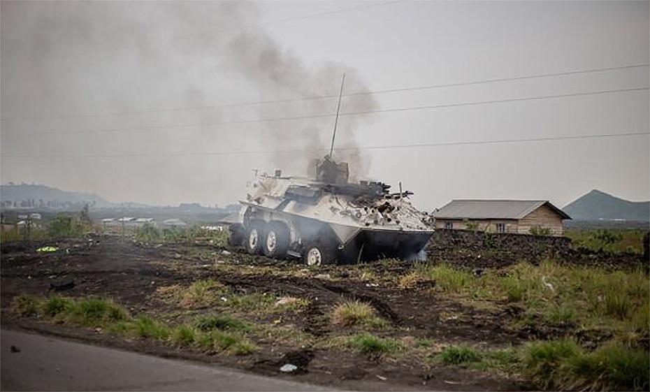 Smoke rises from a Uruguayan Armoured Vehicle General Purpose