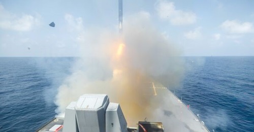 An RGM-109 Tomahawk featuring a black fuselage, possibly the Block Va Maritime Strike Tomahawk, is launched from the USS 
        
        during Operation 'Epic Fury'.