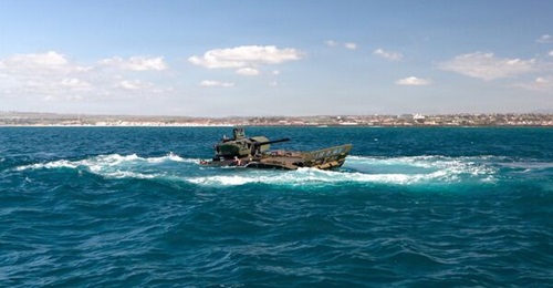 The Textron Advanced Reconnaissance Vehicle 30 mm cannon (ARV-30) prototype conducts open water testing at Camp Pendleton, CA.