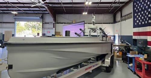 A static display of the Blue Ops 7 m Variant 7 USV at the company's headquarters in West Palm Beach, Florida. Mock missiles from partner company Aeon are shown aft.