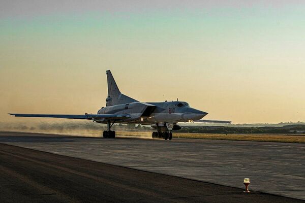 The Russian MoD published this photo on 25 June of a Tu-22M3 bomber with tail number Red 50 carrying a Kh-22 anti-ship missile taking off from Humaymim airbase in Syria. (Russian MoD)