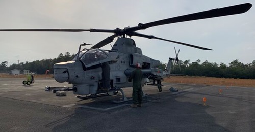 US Marine Corps personnel assigned to Marine Operational Test & Evaluation Squadron 1 (VMX-1) conduct operational checks on AH-1Z Viper at Eglin AFB on 4 November to ensure aircraft readiness during the operational test and evaluation of the AGM-179 JA...