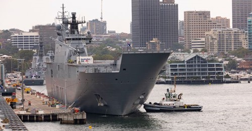 The Royal Australian Navy's landing helicopter dock ship HMAS 
        
        pictured departing Sydney in support of disaster relief efforts in Tonga.