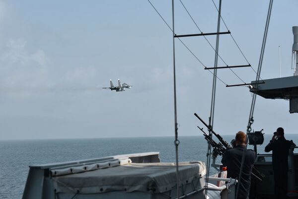 
        Russian Su-30SM multirole fighter carrying what appears to be a Kh-31 anti-ship missile flying by the RNLN LCF frigate 
        Evertsen
         in the Black Sea on 24 June.
       (Dutch MoD)