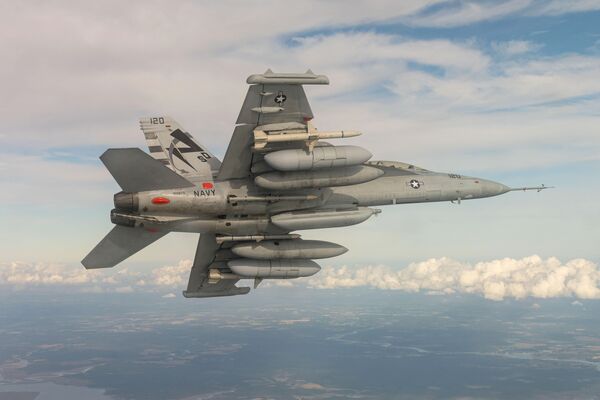 An EA-18G Growler from Air Test and Evaluation Squadron 23, located at NAS Patuxent River, Maryland, conducts a NGJ-MB flight test over southern Maryland. The AN/ALQ-249(V)1 NGJ-MB will provide the EA-18G Growler with the ability to effectively engage enemy threats from increased stand-off distances, employ increased capacity against enemy targets, and support agile employment by operators.  (US Navy)