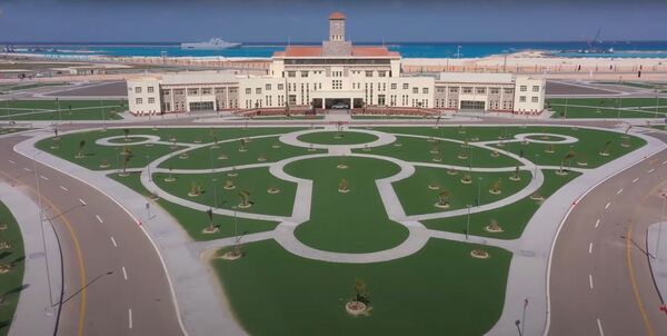 A still from a video released by the Egyptian Ministry of Defence shows the HQ building at the 3 July Naval Base with a Mistral in the background. (Egyptian Ministry of Defence)