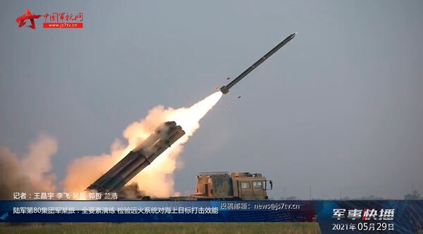 A screengrab from footage provided by CCTV on 29 May showing a PHL-03 MRL at Bohai Bay launching a rocket at a simulated target at sea. (CCTV)