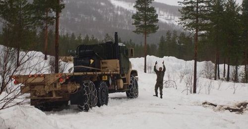 To prepare for Arctic transportation challenges in 'Cold Response 2022' in Norway this March, US Marine Corps logistic units trained using chains on their wheeled vehicles.