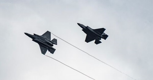 Two US Air Force F-35 Lightning II aircraft assigned to the 34th Fighter Squadron at Hill Air Force Base, Utah, fly over the 86th Air Base, Romania, on 24 February 2022.