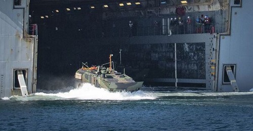 A USMC Amphibious Combat Vehicle (ACV) heads into the water. The service is outfitting the vehicles modified tow ropes.