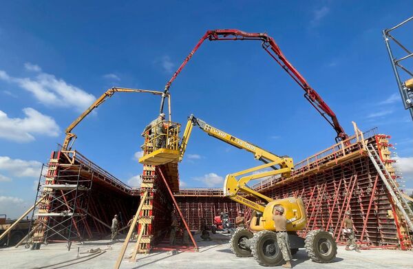 A detachment from US Naval Mobile Construction Battalion 11 pours concrete for the walls of a new building at Hatzor Air Base.   (US Naval Mobile Construction Battalion 11 )