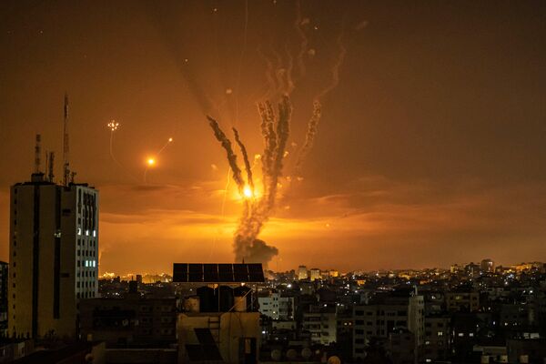 Rockets launched towards Israel from the northern Gaza Strip are targeted by Israel's Iron Dome missile defence system on 14 May 2021. The USMC is moving forward with a new initiative that will repackage the Tamir launcher on a trailer.  (Fatima Shbair/Getty Images)