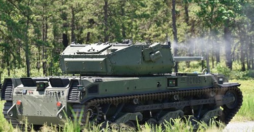 An RCV-M prototype fires a round at a target during the vehicle's live-fire testing at Fort Dix, New Jersey, in June 2021. The service has decided it will postpone development of this larger robot, and instead focus on developing the RCV-L.