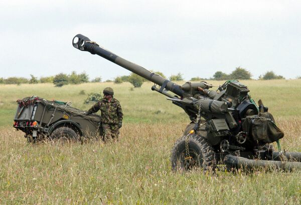 An L118 Light Gun waiting to be airlifted by an RAF Chinook. (Janes/Patrick Allen)