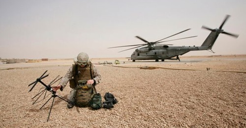 A US Marine Corps field radio operator from the 26th Marine Expeditionary Unit set up satellite communication at Camp Korean Village, Iraq, in 2008.