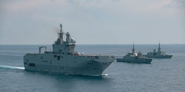 
        French Navy ships 
        Tonnerre
         (foreground) and 
        Surcouf 
        (extreme right), seen here in a May 2021 PASSEX with RSS 
        Steadfast,
         in the South China Sea. 
       (French Navy)