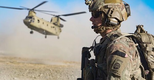 A US Army soldier in southeastern Afghanistan. The US and UK announced on 12 August that they will deploy 3,000 and 600 troops respectively to Afghanistan to help evacuate their civilians and Afghan special immigrant visa applicants.