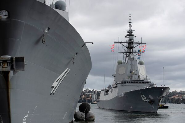 
        HMAS
        Sydney
        (in the background) departing its home port at Fleet Base East, Sydney, on 11 March to trial its Aegis Weapon System with the US Navy.
       (Royal Australian Navy/Commonwealth of Australia )