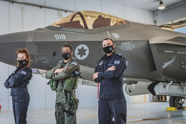 IAF personnel pose in front of one of six F-35I Adir aircraft that have been deployed to Italy for the service's first overseas exercise using the type. (Israeli Air Force)