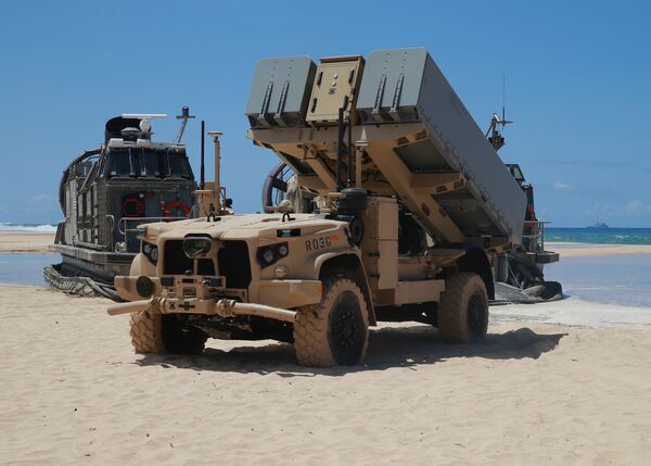 A Navy Marine Expeditionary Ship Interdiction System (NMESIS) launcher deploys into position aboard Pacific Missile Range Facility Barking Sands, Hawaii, on 16 August. The NMESIS and its Naval Strike Missiles participated in a live-fire exercise during Large-Scale Exercise 2021. (US Marine Corps)