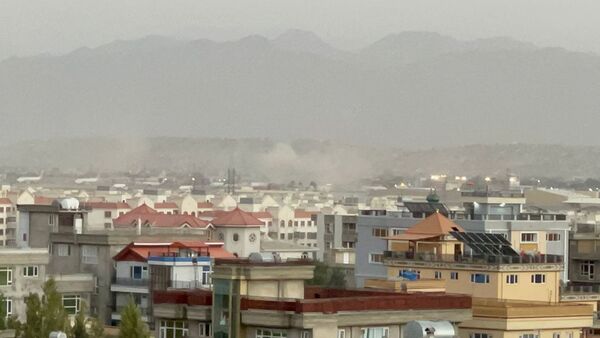 Smoke rises in Kabul on 26 August following attacks by IS-K suicide bombers and gunmen outside Hamid Karzai International Airport, the centre of evacuation efforts from Afghanistan, that killed at least 72 civilians and 13 US military personnel. (Haroon Sabawoon/Anadolu Agency via Getty Images)