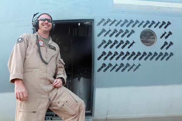 An airman poses next to the operational ‘kill' markings stencilled onto the fuselage of a Harvest HAWK in Afganistan during the war fighting stage of the conflict, giving an indication of the type's work rate in the close air support role. The USMC has now contracted SNC to enhance the aircraft's capability with a BLOS capability. (US Marine Corps)