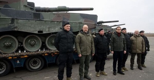 The first four Leopard 2A4 tanks were delivered to Ukraine on 24 February in the presence of Ukrainian Prime Minister Denys Shmyhal (second from left), Poland's Council of Ministers Chairman Mateusz Morawiecki (centre), and Ukrainian Defence Minister O...
