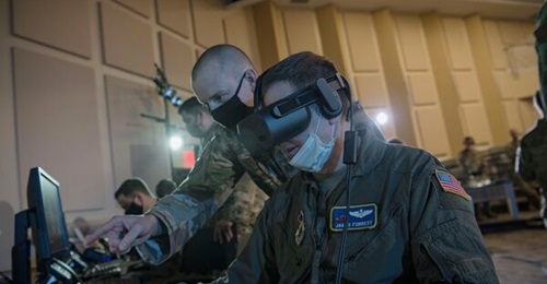 A US Air Force officer operates a virtual reality headset in support of the Advanced Battle Management System (ABMS) Onramp 2 on 2 September 2020 at Joint Base Andrews, Maryland. The ABMS is the air-domain component of the CJADC2 capability.