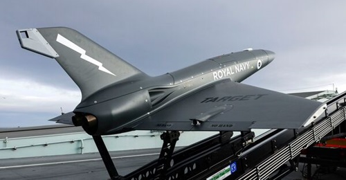 A QinetiQ Banshee Jet 80+ target vehicle pictured on its launcher on HMS 
        
         flight deck.