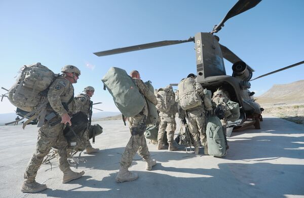 US soldiers boarding a Chinook helicopter in the Gardez district of Afghanistan's Paktia Province in 2011. USCENTCOM announced on 15 June that the Pentagon has already completed more than 50% of the military retrograde process in Afghanistan. (Ted Aljibe/AFP via Getty Images)