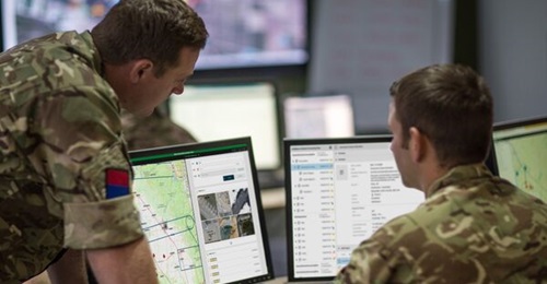 British military personnel view the SitaWare Insight intelligence management software. SitaWare Insight is intended to support staff across intelligence, planning, and operations at all levels of command.