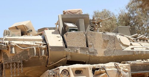 A Merkava Mk 4 tank that has lost the shield that covers one of its Trophy launchers during combat in the Gaza Strip.