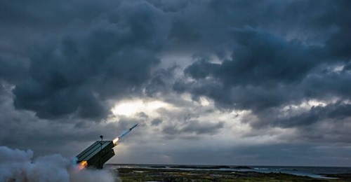 A NASAMS AMRAAM-ER interceptor is launched at a Meggitt Banshee 80 target drone at the Andøya Space centre, Norway, in 2016.
