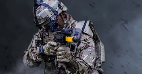 A British soldier using Saab TES equipment. Note the laser detector on top of the helmet, the detector harness, and the laser projector above the barrel of the weapon.