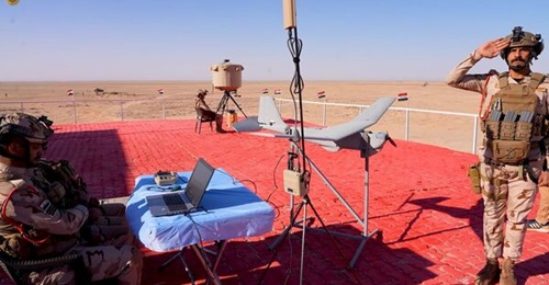A Puma UAV with a TPQ-49 radar in the background during Exercise 'Fire Eagle'.