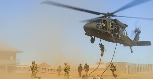 Australian Army soldiers and aviators conduct helicopter insertion and extraction training as part of UH-60M Black Hawk introduction into service activities in September 2024.