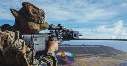 A US marine aims a ZeroMark fire-control system attached to an M27 Infantry Automatic Rifle during a live-fire demonstration at Marine Corps Base Hawaii.