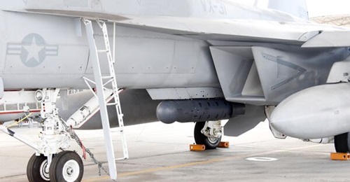 A Litening pod mounted on the centreline of a US Navy F/A-18F for testing.