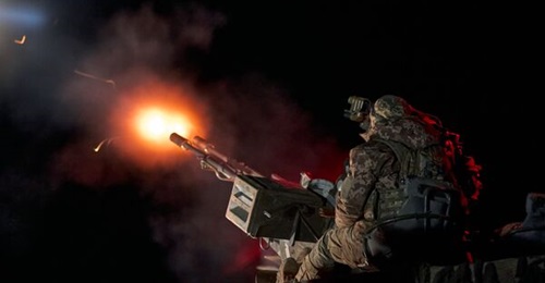 Ukrainian soldiers from a mobile air-defence group shoot down enemy drones using a ZU-23-2 Soviet 23-mm twin anti-aircraft gun on 16 April 2024 at an undisclosed location in Ukraine.