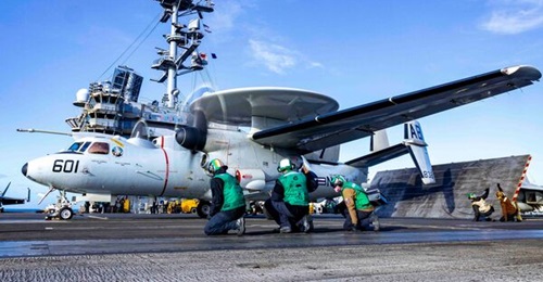An E-2D Advanced Hawkeye, attached to the 'Seahawks' of Airborne Command and Control Squadron (VAW) 126, prepares to take off from the flight deck of the Nimitz-class aircraft carrier USS 
        
        (CVN 75) on 21 October 2024.