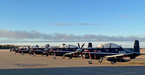 Beechcraft T-6C aircraft destined for the Vietnam People's Air Force are parked on a flight line in Canada before they are scheduled to make the flight to the southeast Asian country.