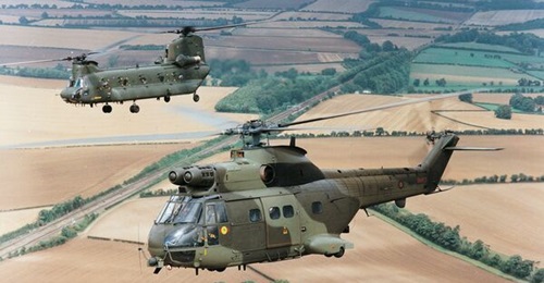 The UK is to axe its oldest Puma (foreground) and Chinook (background) helicopters as it looks to save hundreds of millions of pounds ahead of the SDR due in March 2025.